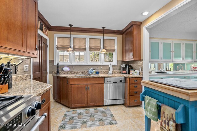 330 Bostwick Ave, Daytona Beach, FL 32118 - kitchen featuring tasteful backsplash, plenty of natural light, appliances with stainless steel finishes, and a sink