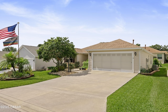 single story home with roof with shingles, concrete driveway, cooling unit, an attached garage, and a front lawn