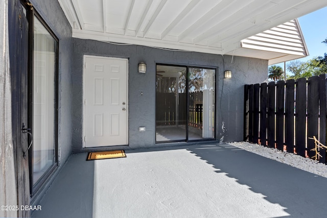 entrance to property featuring a patio area