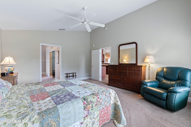 carpeted bedroom with ceiling fan, ensuite bath, and vaulted ceiling