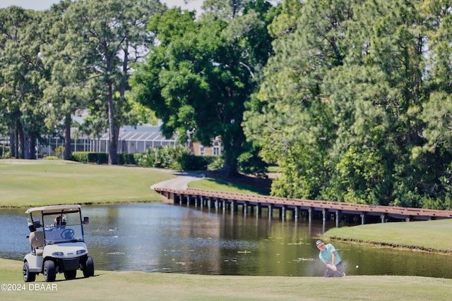 view of home's community featuring a yard and a water view