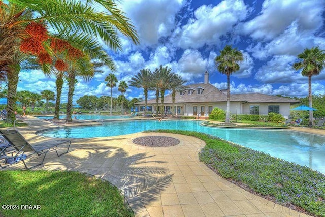 view of swimming pool with a patio area