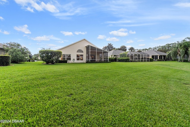 view of yard with glass enclosure