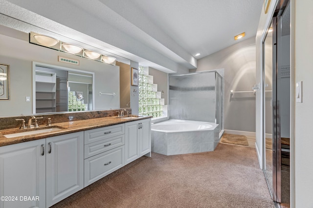 bathroom featuring vanity and plus walk in shower