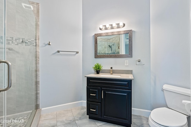 bathroom with an enclosed shower, vanity, and toilet