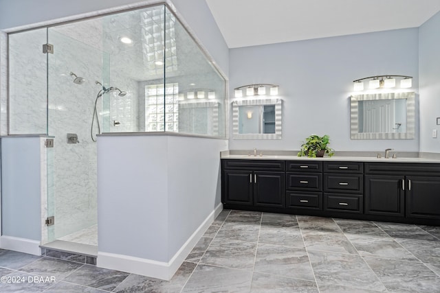 bathroom featuring vanity and an enclosed shower