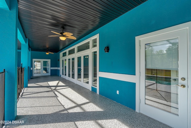 view of patio / terrace featuring ceiling fan and french doors