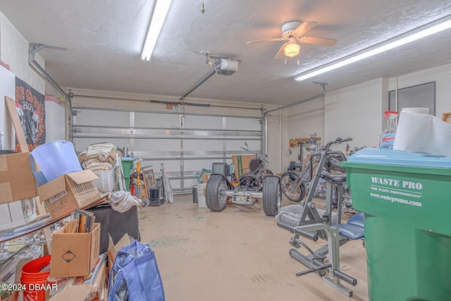 garage with a ceiling fan and a garage door opener