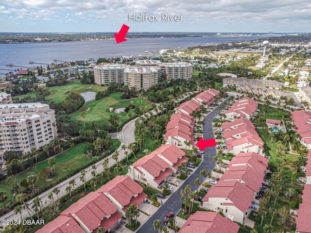 aerial view featuring a view of city, golf course view, and a water view