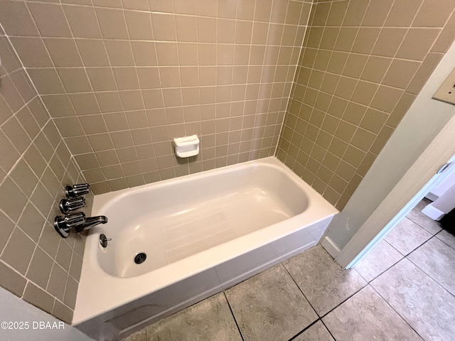 bathroom featuring tile patterned floors and washtub / shower combination