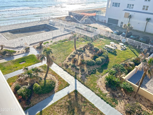 birds eye view of property featuring a view of the beach and a water view