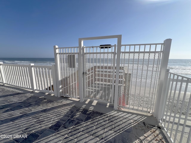 exterior space with a beach view and a water view