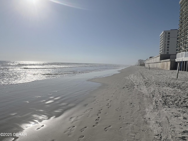 view of water feature with a beach view