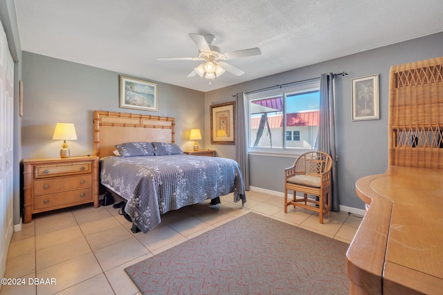 2801 N Halifax Ave N Unit 238, Daytona Beach, FL 32118 - bedroom with tile patterned floors, baseboards, and ceiling fan