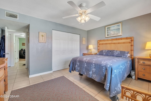2801 N Halifax Ave N Unit 238, Daytona Beach, FL 32118 - bedroom featuring tile patterned flooring, a closet, a ceiling fan, and baseboards
