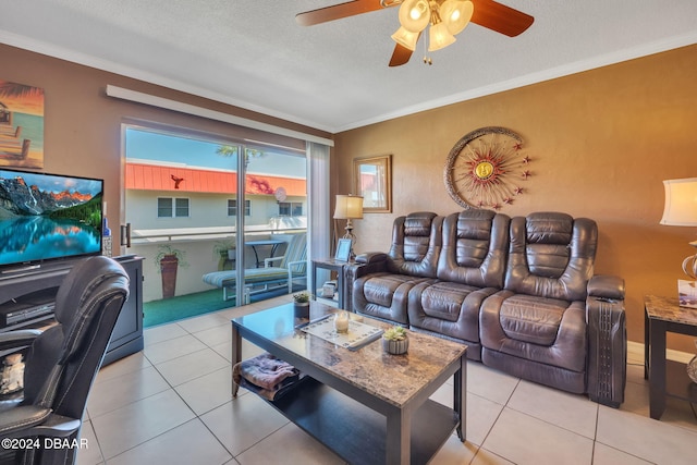 2801 N Halifax Ave N Unit 238, Daytona Beach, FL 32118 - tiled living area with ceiling fan, crown molding, and a textured ceiling