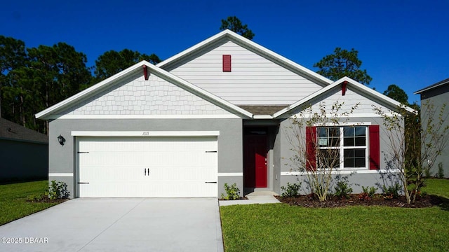 1263 Big Bass Dr, Ormond Beach, FL 32174 - view of front of home with a garage, concrete driveway, a front yard, and stucco siding