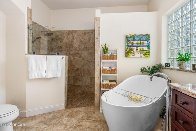 1324 Munster Cir, Ormond Beach, FL 32174 - bathroom featuring walk in shower, a soaking tub, and vanity