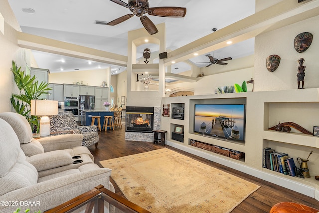 1324 Munster Cir, Ormond Beach, FL 32174 - living room with ceiling fan, dark wood-type flooring, a multi sided fireplace, recessed lighting, and vaulted ceiling