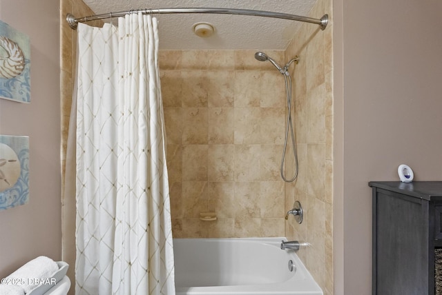 bathroom with shower / bath combo, a textured ceiling, and toilet