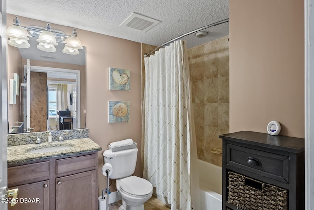 full bathroom with vanity, a textured ceiling, toilet, and shower / bath combo
