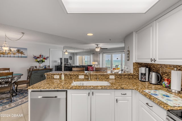 kitchen with ceiling fan with notable chandelier, dishwasher, kitchen peninsula, sink, and white cabinetry