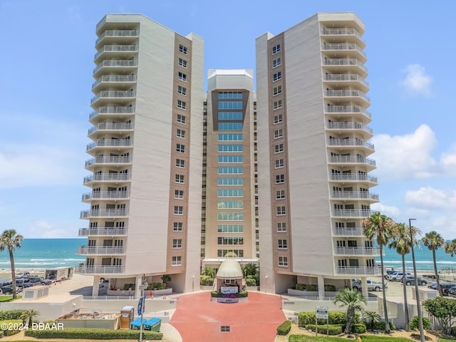 view of building exterior with a water view