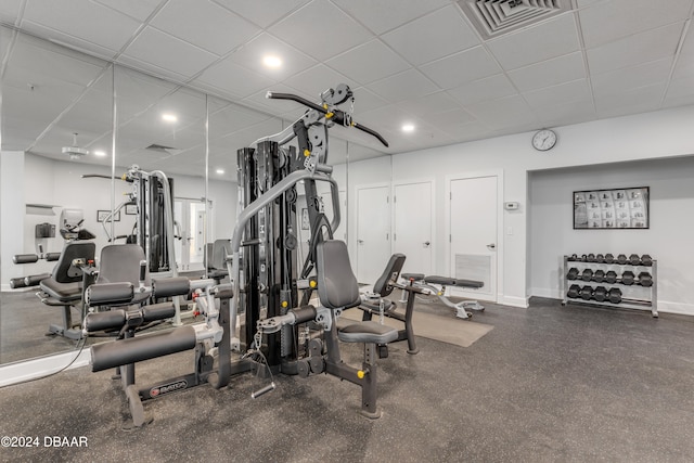 gym featuring a drop ceiling