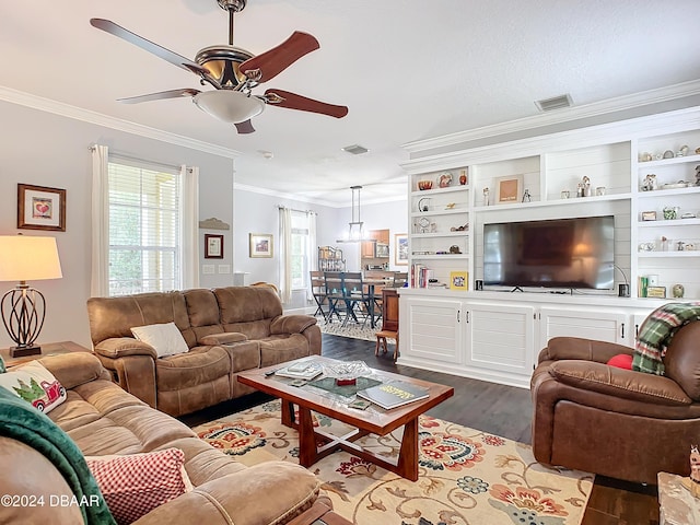 living room featuring ceiling fan, crown molding, and light hardwood / wood-style flooring