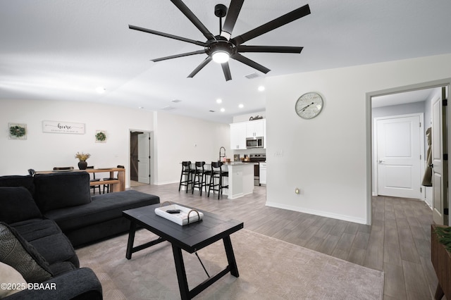 2518 Hoptree Ln, Edgewater, FL 32141 - living room featuring recessed lighting, wood finished floors, visible vents, a ceiling fan, and baseboards