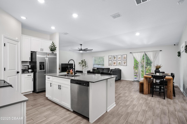 2518 Hoptree Ln, Edgewater, FL 32141 - kitchen featuring light wood finished floors, a wealth of natural light, appliances with stainless steel finishes, and a sink