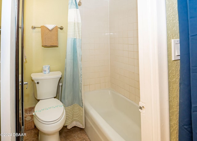 bathroom with tile patterned floors, toilet, and shower / tub combo