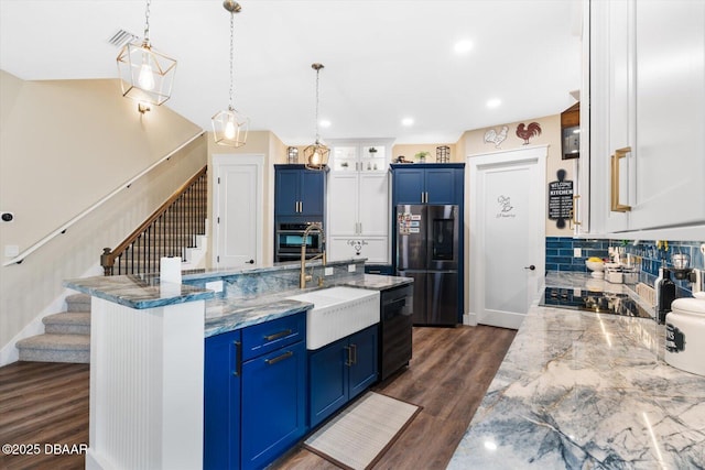 4 Oakview Ct, Palm Coast, FL 32137 - kitchen featuring refrigerator, blue cabinets, a sink, wall oven, and recessed lighting