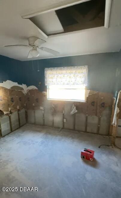 miscellaneous room featuring concrete floors and ceiling fan