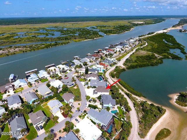 bird's eye view featuring a water view and a residential view