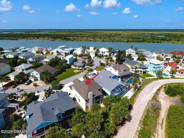 aerial view featuring a residential view and a water view