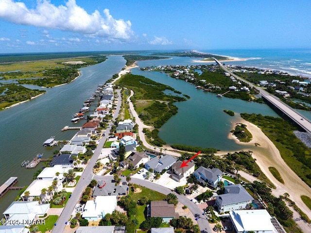 drone / aerial view with a residential view and a water view