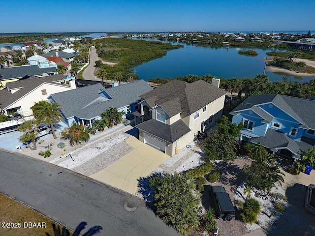 bird's eye view with a residential view and a water view