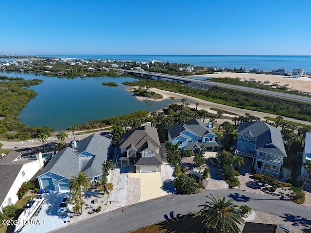 birds eye view of property with a residential view and a water view