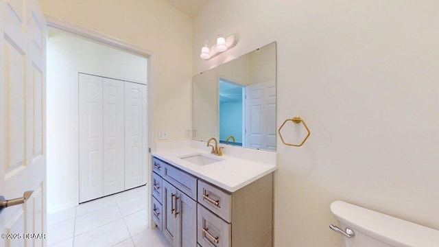 bathroom featuring tile patterned floors, toilet, and vanity