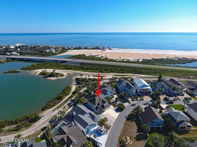 birds eye view of property with a residential view, a view of the beach, and a water view