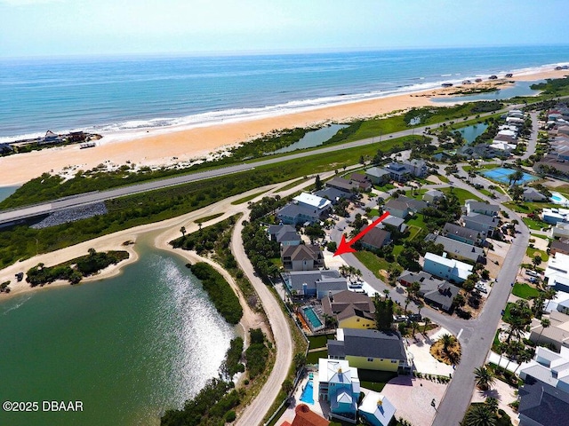 bird's eye view with a beach view and a water view