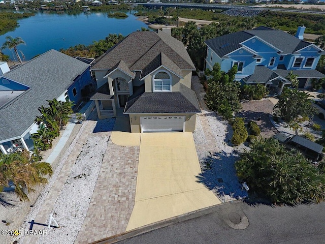 drone / aerial view with a residential view and a water view