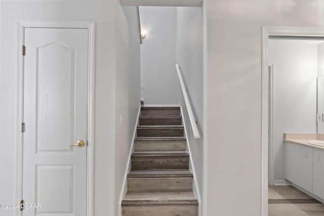 stairway featuring hardwood / wood-style floors