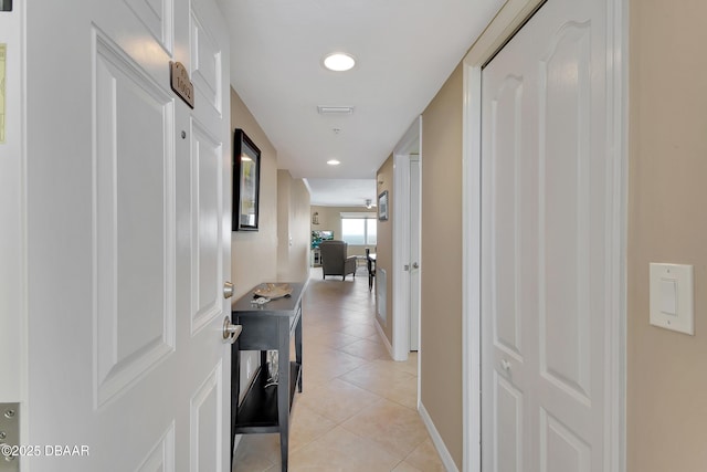 corridor with light tile patterned floors