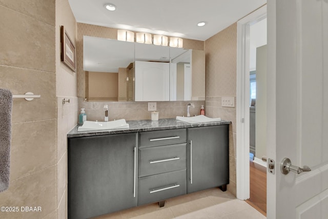 bathroom featuring tile walls, vanity, and tile patterned flooring