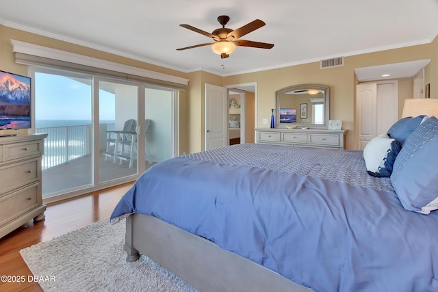 bedroom with crown molding, access to outside, ceiling fan, and light wood-type flooring