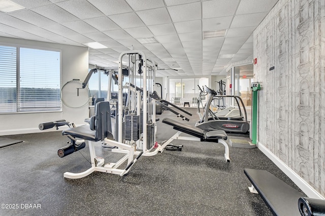 exercise room featuring a paneled ceiling