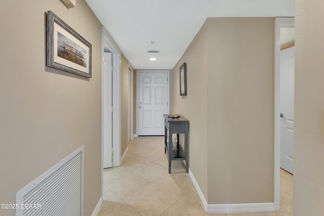 hallway with light tile patterned flooring