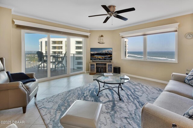 living room featuring ornamental molding, ceiling fan, and light tile patterned flooring